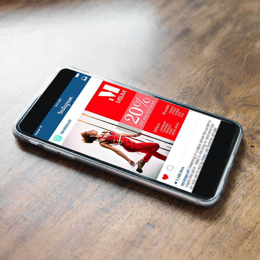 Mockup image of man's hands holding white mobile phone with blank screen in modern cafe
